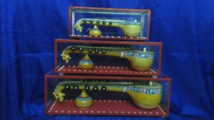 Decorative Bobbili Veena handcrafted from jackfruit wood with intricate carvings and rich tonal quality. 