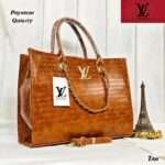 Sophisticated LV Tote Bag in tan, featuring trendy hand block prints, premium crocodile material, a spacious compartment, and an adjustable strap for versatile styling.