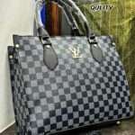 Sophisticated black Louis Vuitton tote bag with premium crocodile material, featuring a spacious single compartment, sturdy handles, and elegant hand block prints.