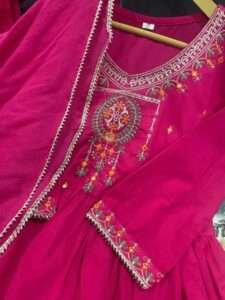 Cotton kurta sharara set with embroidered neck yoke, lacework, and malmal dupatta in pink and blue.