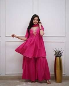 Cotton kurta sharara set with embroidered neck yoke, lacework, and malmal dupatta in pink and blue.
