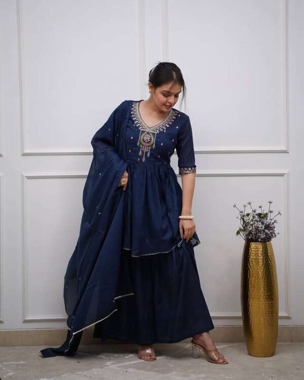 Cotton kurta sharara set with embroidered neck yoke, lacework, and malmal dupatta in pink and blue.