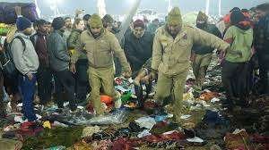 Rescue teams assisting injured devotees after the Mahakumbh Mela 2025 stampede in Prayagraj.