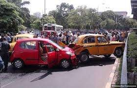 A major car accident at a busy Indian intersection due to traffic rule violation.